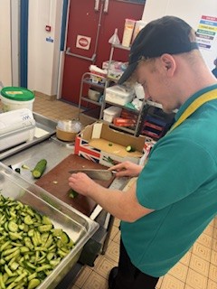 Harry preparing salad in our Bay View restaurant's kitchen.
