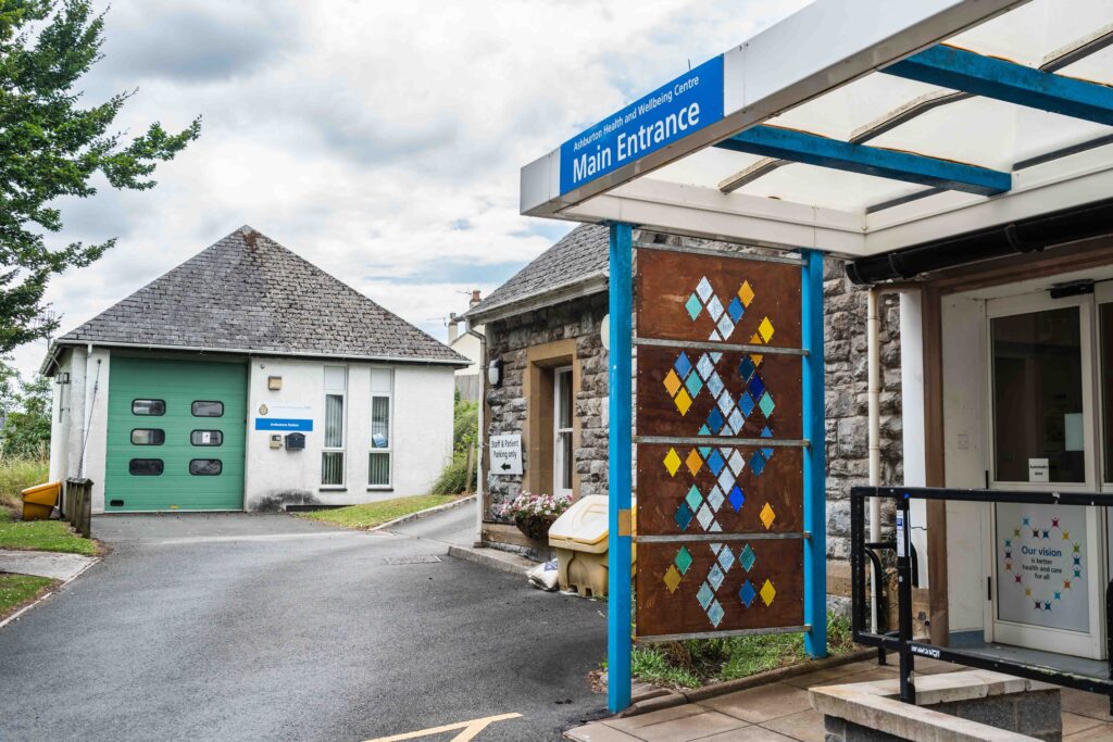 Amy Whittingham's cut glass stain-glassed window installation at the entrance to Ashburton's Health and Wellbeing Centre