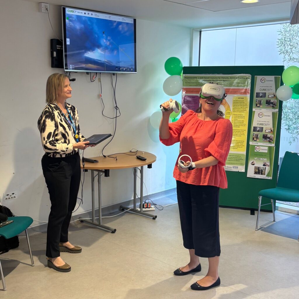 Physiotherapist Phillipa Newton-Cross, demonstrating the immersive VR therapy