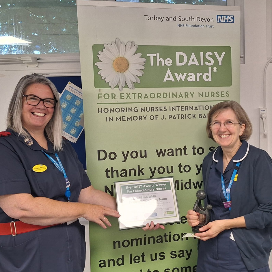 Natalie Herring presenting Alison White with her Daisy Award