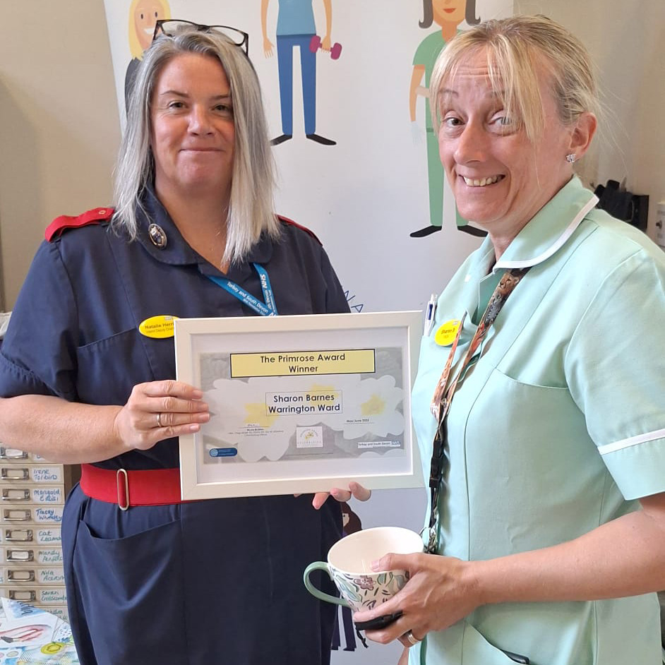Natalie Herring presenting Sharon Barnes with her Primrose Award