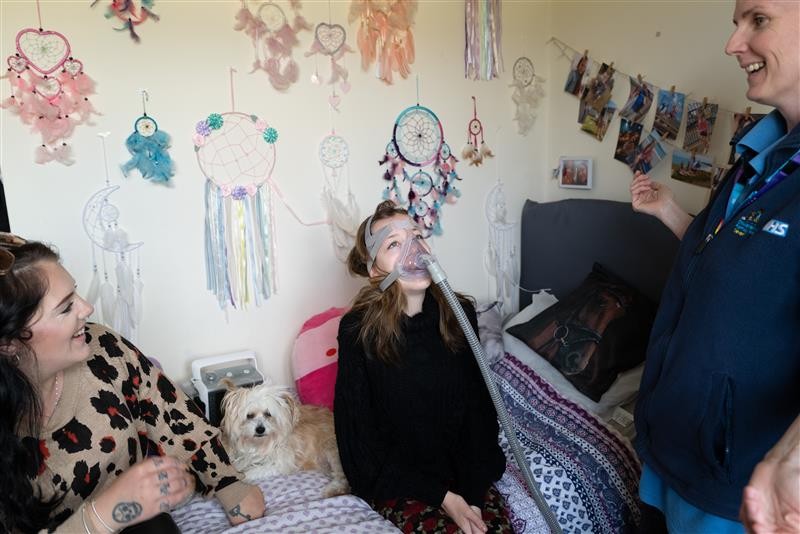 Community children’s nurse with patient and parent