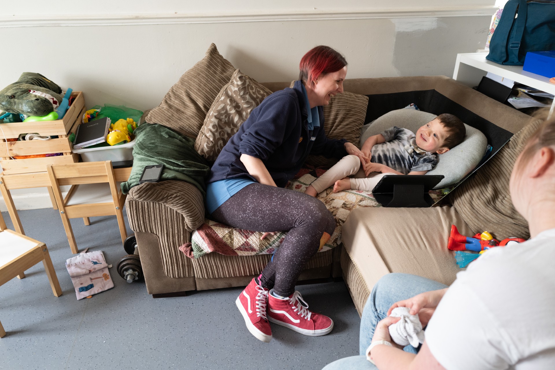 Community children’s nurse with patient and parent