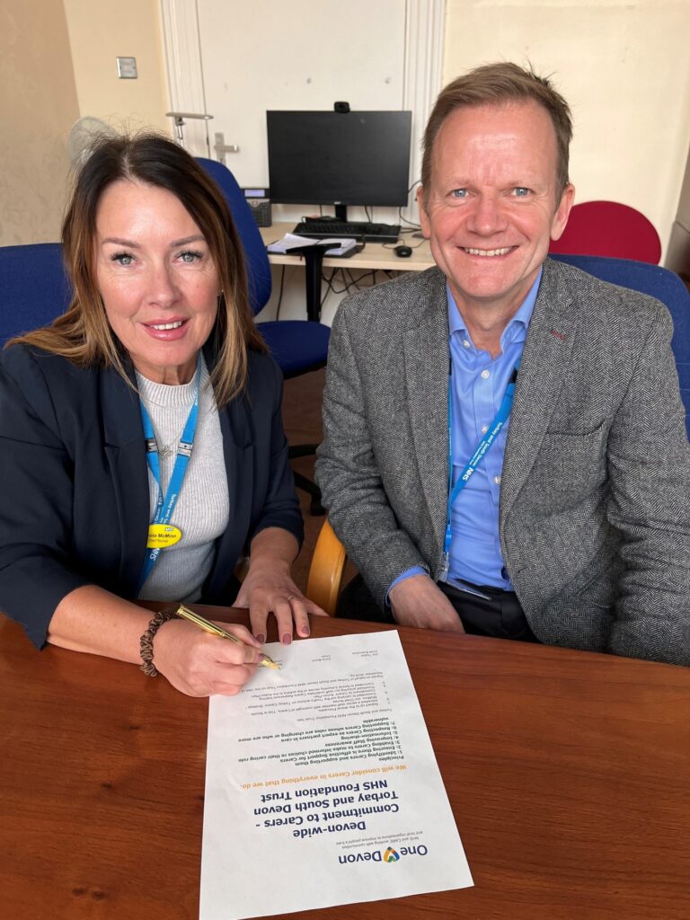 Chief Executive, Joe Teape, and our Chief Nurse, Nicola McMinn, signing our Commitment to Carers pledge