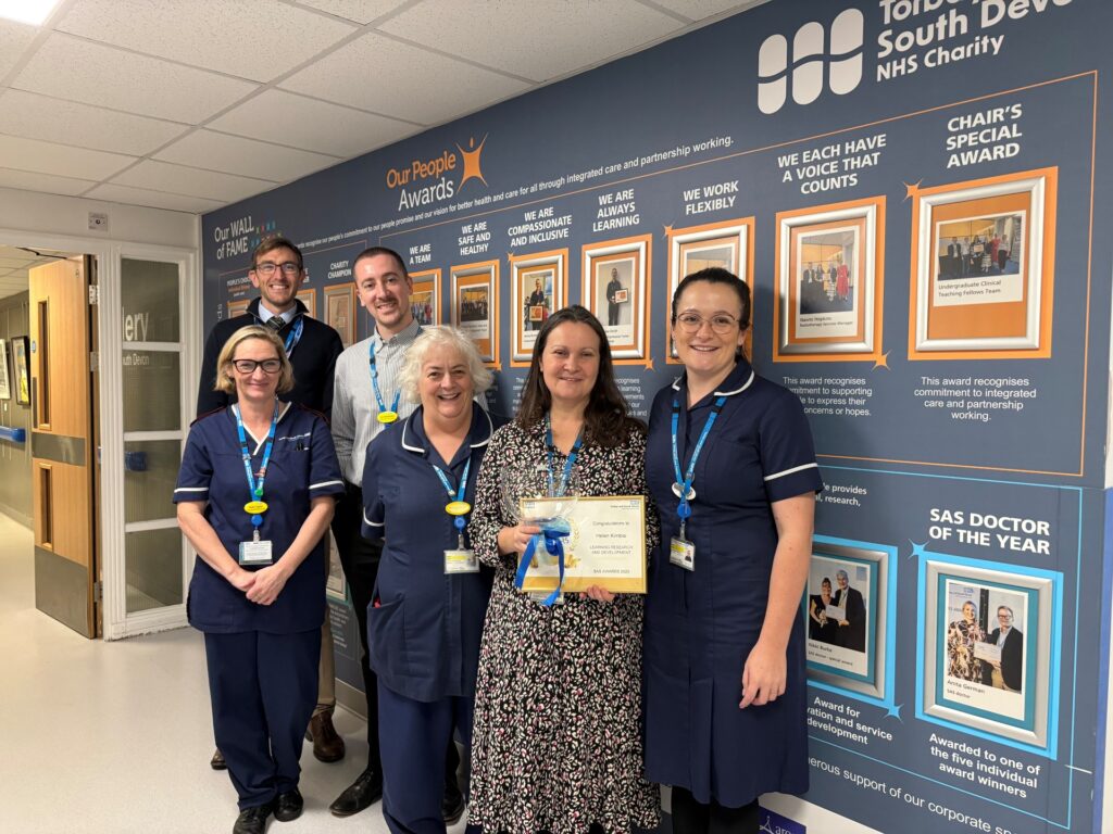 Dr Helen Kimble with her SAS Doctors Award, and some of her colleagues