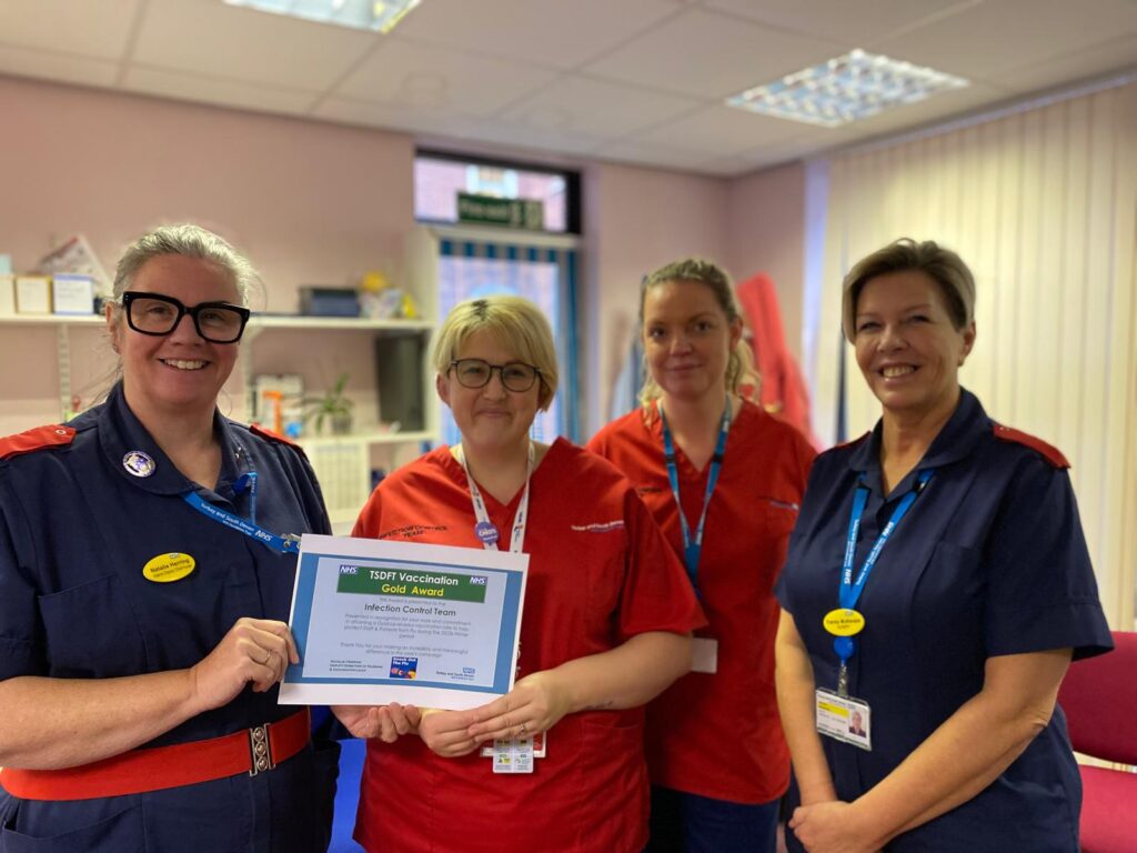 Natalie Herring presenting the members of the Infection Control Team their Gold Award