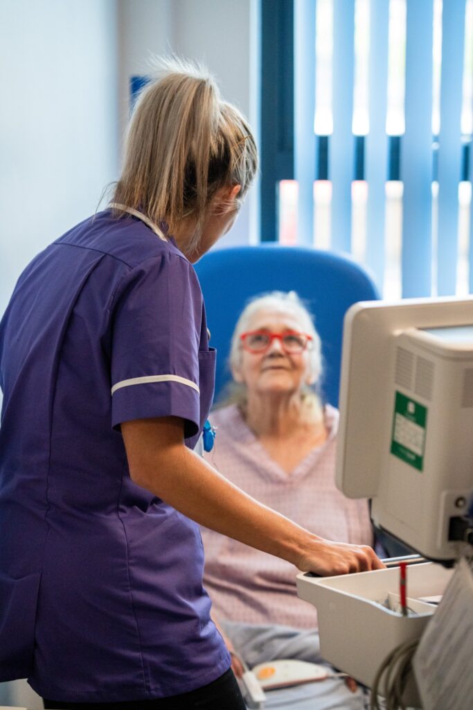 Nurse with older person at our new community frailty service, The Harbour, in Newton Abbot Community Hospital.