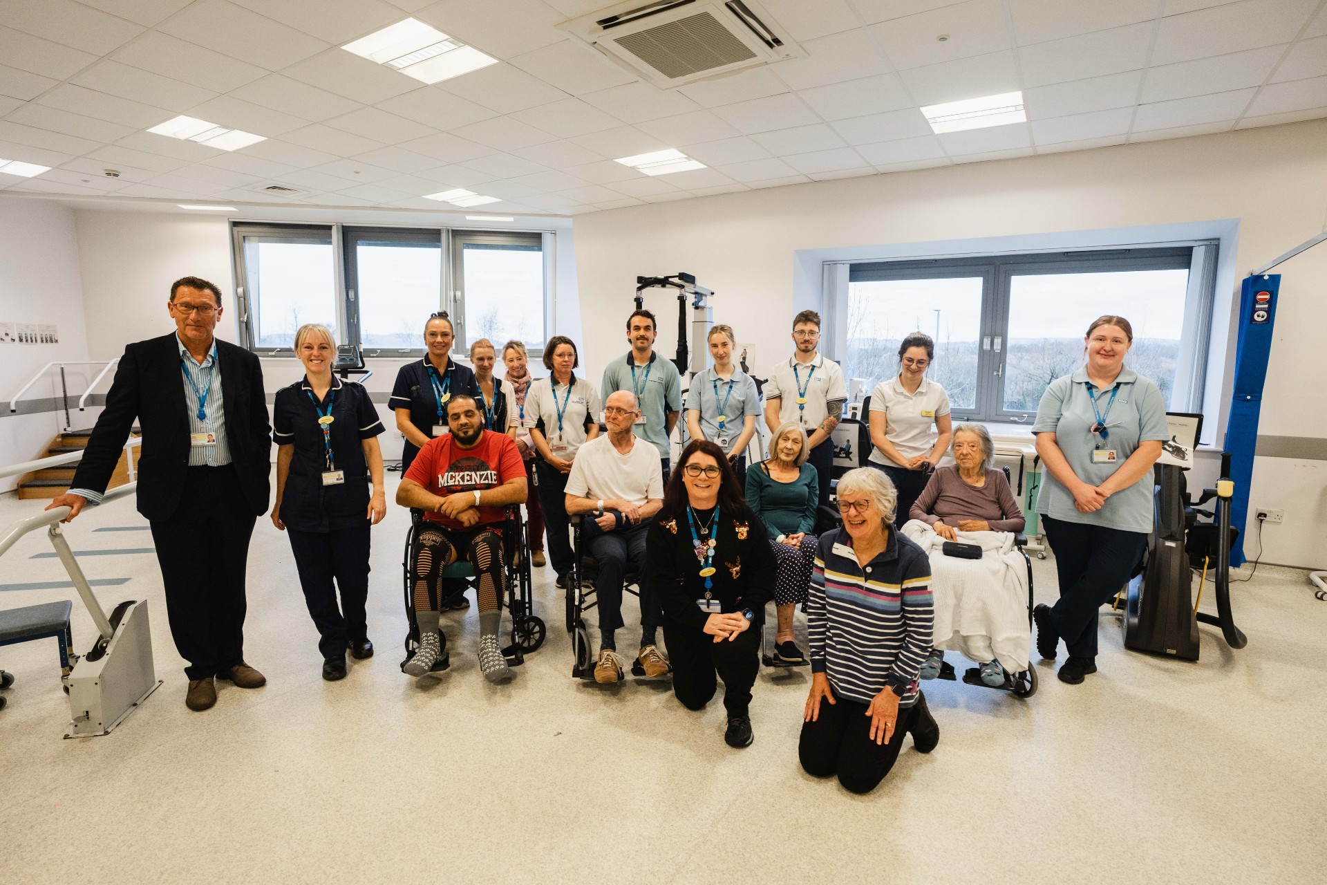 Community Neuro Rehabilitation colleagues, Martin Beaman, Vice Chair, Newton Abbot Hospital’s League of Friends, and patients in the hospital's gym room
