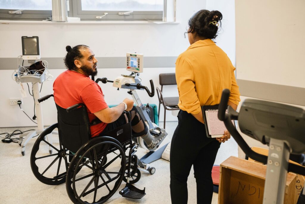 Patient with consultant in Newton Abbot Community Hospital's rehab gym