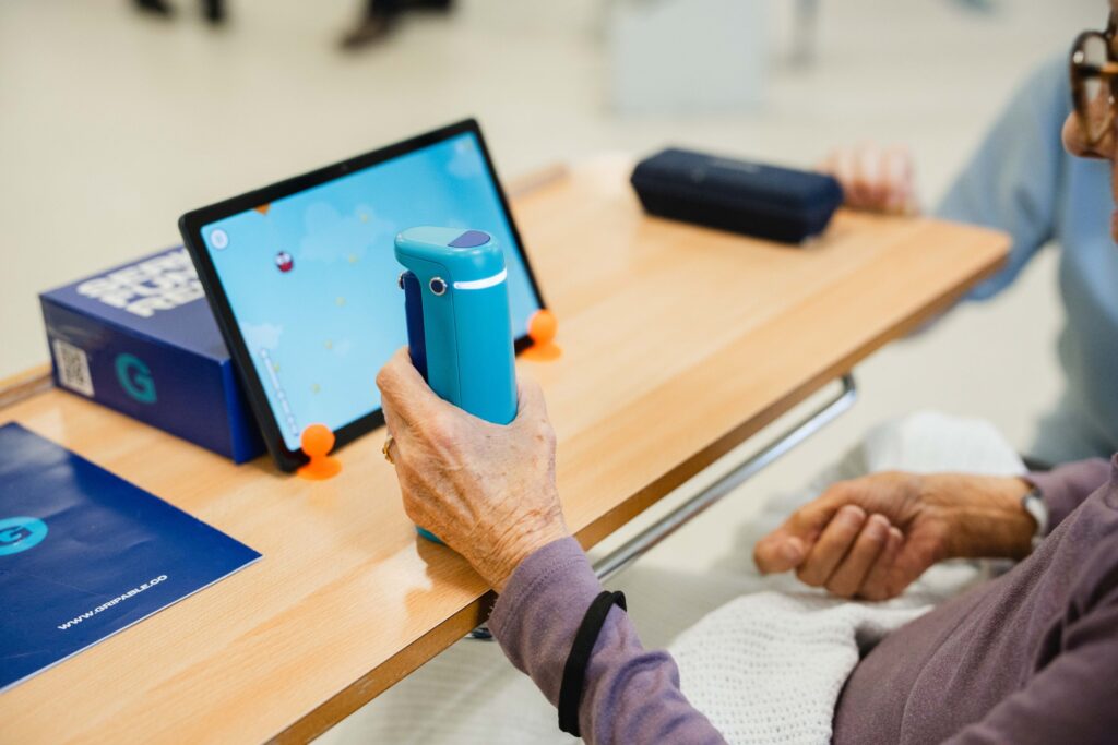 Patient with new gym equipment in Newton Abbot Community Hospital's rehab gym