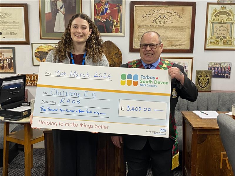 Charity Manager, Becky Chown, being presented with a cheque by the Royal Antediluvian Order of Buffaloes (ROAB),