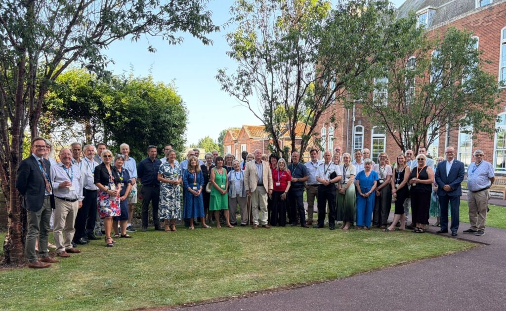 Group photo of colleagues, partners and members of our local communities marking 100 years since the foundation stone was laid at Torbay Hospital