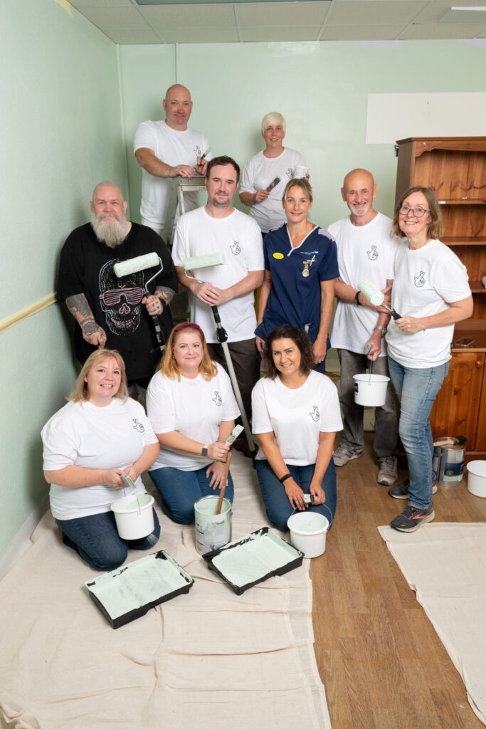 Lucy and her husband Jon, with fellow lottery winners who helped transform and decorate Cheetham Hill ward’s communal space,