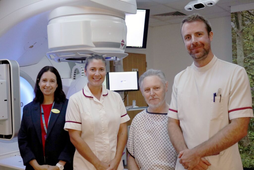 Stephen Dwyer-Lapthorne and Naomi Hopkins, Head of Radiotherapy, with colleagues from the Radiology Department