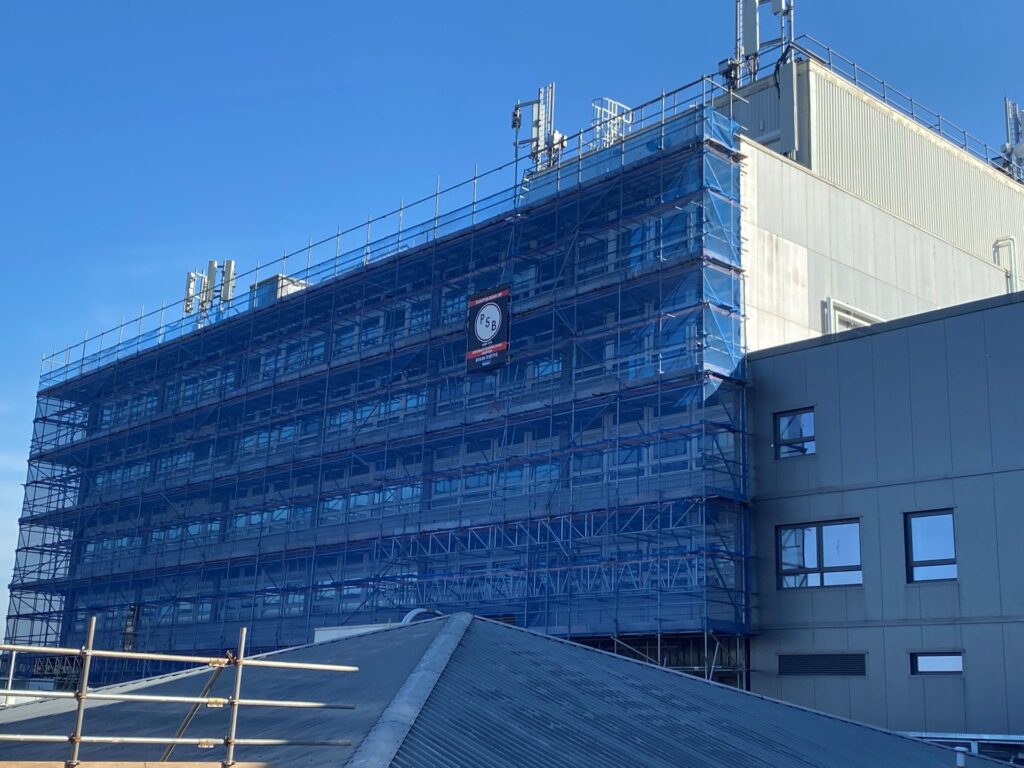 Exterior photo of Torbay Hospital's Tower Block with scaffolding