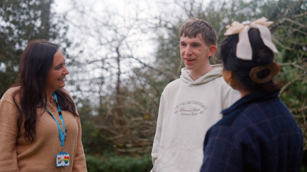 Three people talking