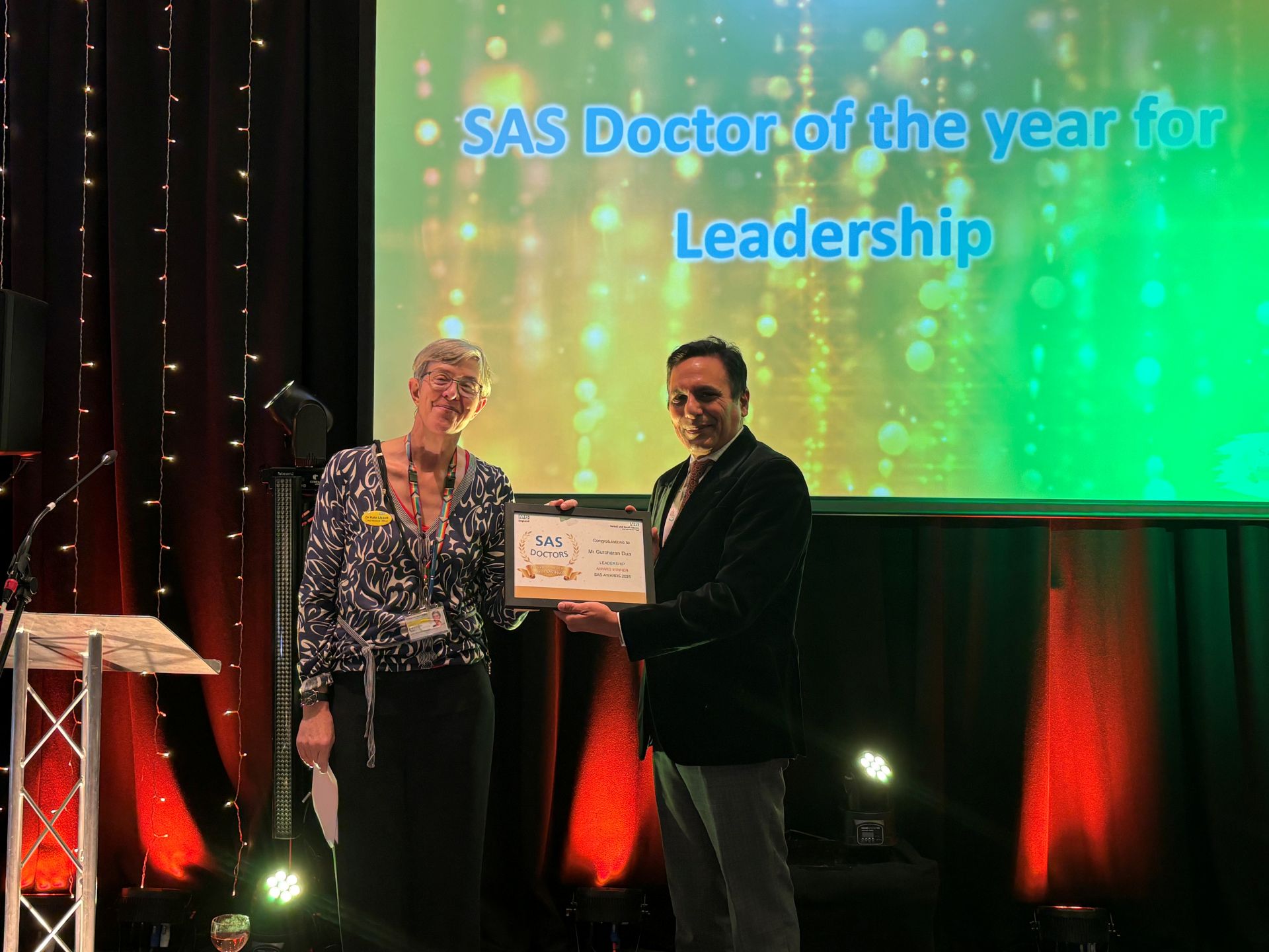 Dr Kate Lisset presenting Dr Gurcharan Dua with his award